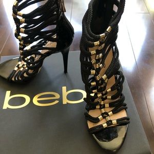 BEBE Black strappy heels.